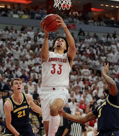 Franz Wagner (21) and Zavier Simpson (3)