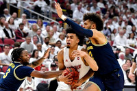 Zavier Simpson (3) and Isaiah Livers (2)