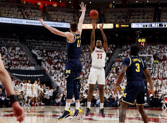 Colin Castleton (11) and Zavier Simpson (3)