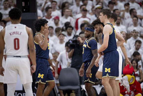 Eli Brooks (55), Zavier Simpson (3), Franz Wagner (21), and Isaiah Livers (2)