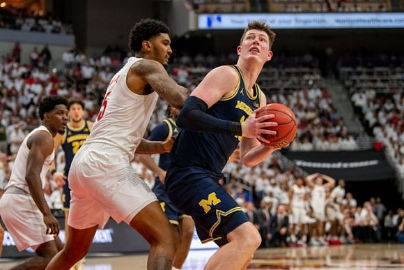 Brandon Johns Jr. (23) and Jon Teske (15)