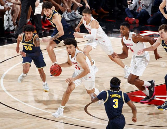 Eli Brooks (55), Brandon Johns Jr. (23), and Zavier Simpson (3)