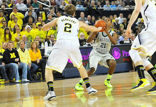 Spike Albrecht (2) and Nik Stauskas (11)