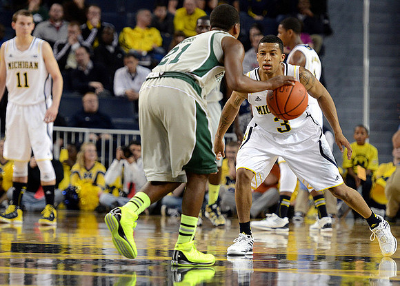 Trey Burke (3) and Nik Stauskas (11)