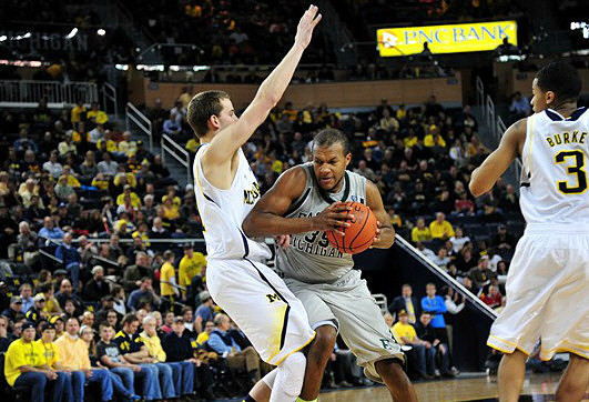 Nik Stauskas (11) and Trey Burke (3)