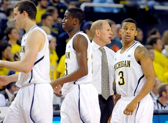 Nik Stauskas (11), Caris LeVert (23), John Beilein, and Trey Burke (3)