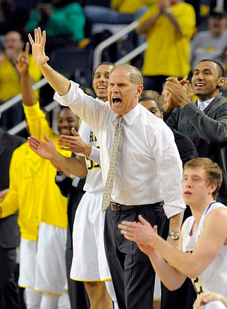 Jordan Morgan (52), John Beilein, Jon Horford (15), and Spike Albrecht (2)