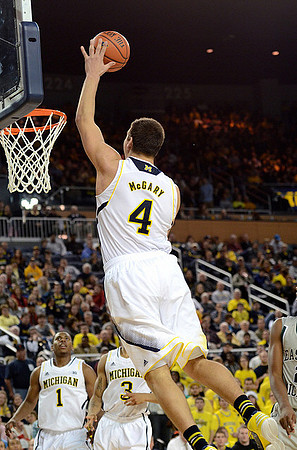 Mitch McGary (4), Glenn Robinson III (1), and Trey Burke (3)