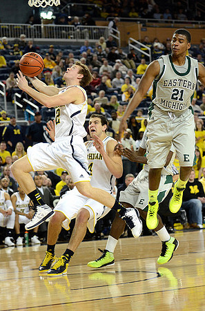 Spike Albrecht (2) and Mitch McGary (4)