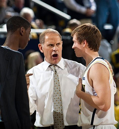 Caris LeVert (23), John Beilein, and Spike Albrecht (2)
