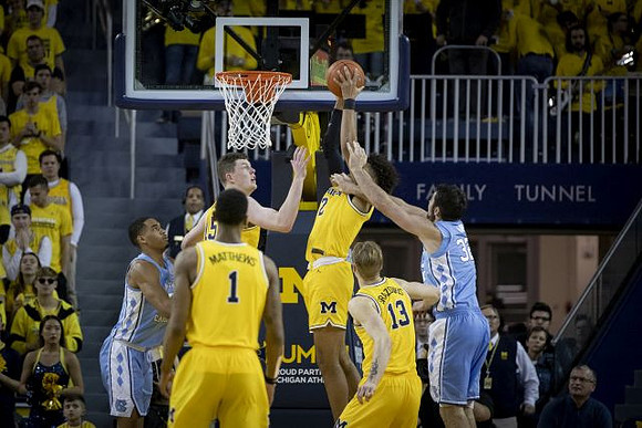 Charles Matthews (1), Jon Teske (15), Jordan Poole (2), and Ignas Brazdeikis (13)