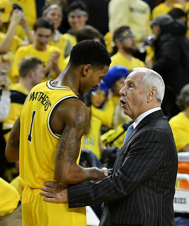 Charles Matthews (1) and North Carolina Head Coach Roy Williams