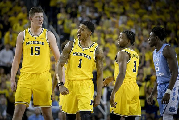 Jon Teske (15), Charles Matthews (1), and Zavier Simpson (3)