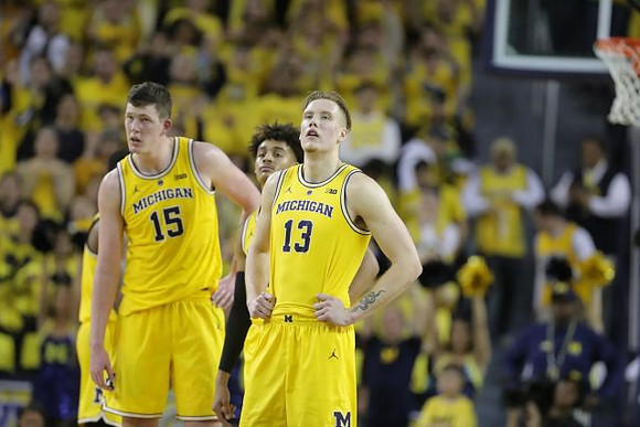 Jon Teske (15), Jordan Poole (2), and Ignas Brazdeikis (13)
