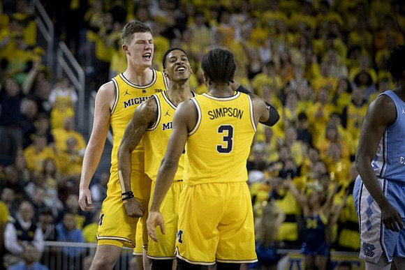 Jon Teske (15), Charles Matthews (1), and Zavier Simpson (3)