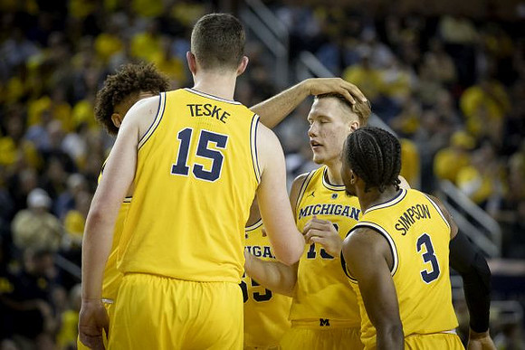 Jon Teske (15), Isaiah Livers (4), Eli Brooks (55), Ignas Brazdeikis (13), and Zavier Simpson (3)