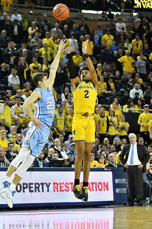Jordan Poole (2) and North Carolina Head Coach Roy Williams