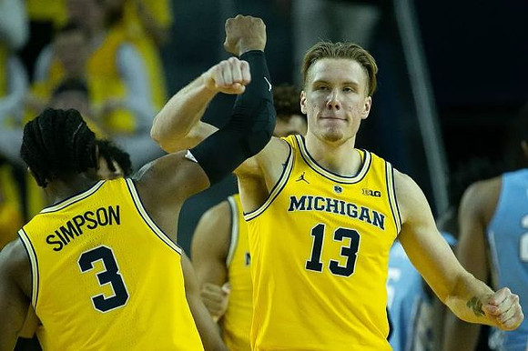 Zavier Simpson (3) and Ignas Brazdeikis (13)