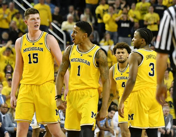Jon Teske (15), Charles Matthews (1), Isaiah Livers (4), and Zavier Simpson (3)