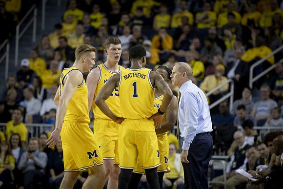 Ignas Brazdeikis (13), Jon Teske (15), Charles Matthews (1), Zavier Simpson (3), and John Beilein
