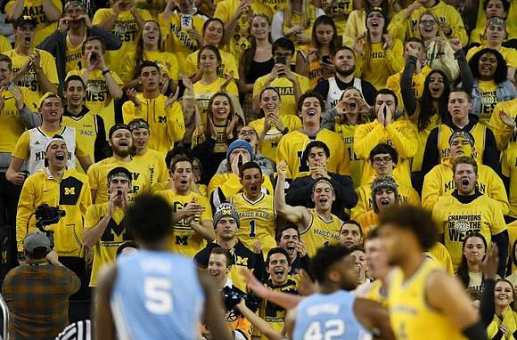Isaiah Livers (4) and Jon Teske (15)