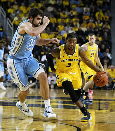 Zavier Simpson (3) and Austin Davis (51)