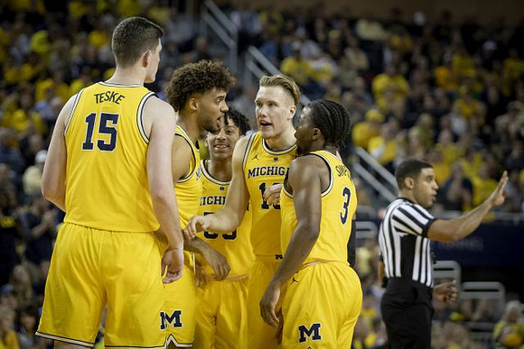 Jon Teske (15), Isaiah Livers (4), Eli Brooks (55), Ignas Brazdeikis (13), and Zavier Simpson (3)