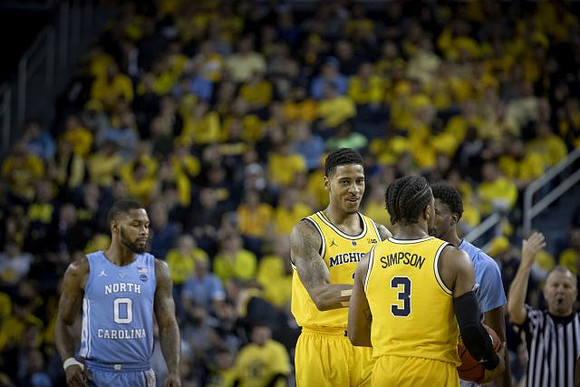 Charles Matthews (1) and Zavier Simpson (3)
