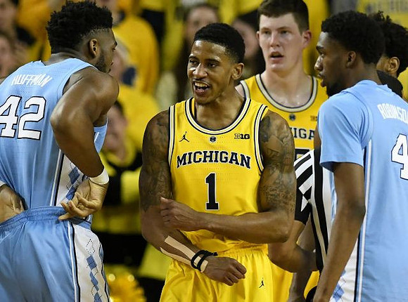 Charles Matthews (1) and Jon Teske (15)