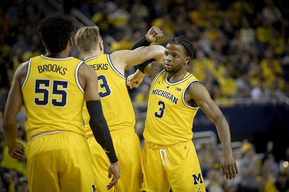 Eli Brooks (55), Ignas Brazdeikis (13), and Zavier Simpson (3)