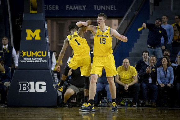 Charles Matthews (1) and Jon Teske (15)