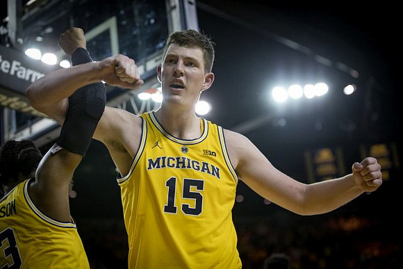 Zavier Simpson (3) and Jon Teske (15)