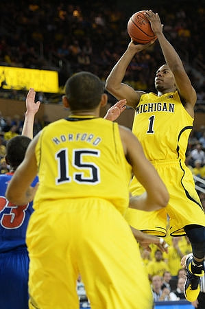 Jon Horford (15) and Glenn Robinson III (1)