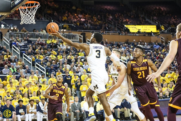 Zavier Simpson (3) and Moritz Wagner (13)