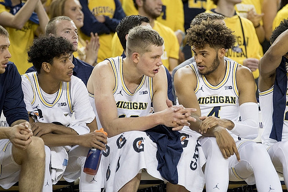 Eli Brooks (55), Moritz Wagner (13), and Isaiah Livers (4)