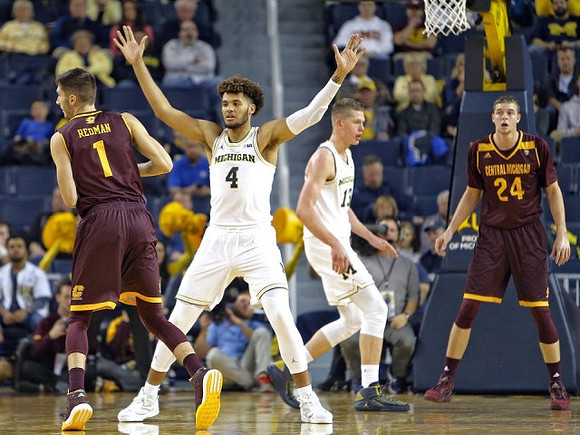 Isaiah Livers (4) and Moritz Wagner (13)
