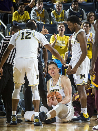 Muhammad-Ali Abdur-Rahkman (12), Moritz Wagner (13), and Zavier Simpson (3)