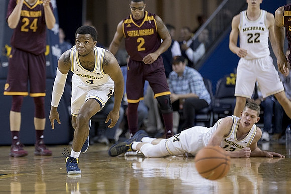 Zavier Simpson (3), Moritz Wagner (13), and Duncan Robinson (22)