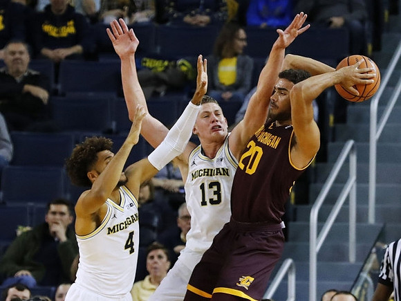 Isaiah Livers (4) and Moritz Wagner (13)