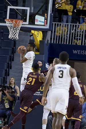 Muhammad-Ali Abdur-Rahkman (12) and Zavier Simpson (3)