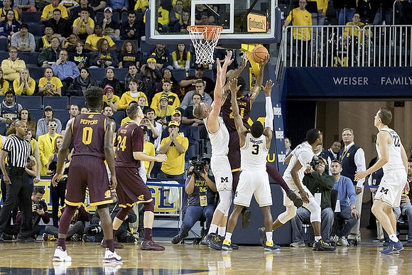Moritz Wagner (13), Zavier Simpson (3), Muhammad-Ali Abdur-Rahkman (12), and Duncan Robinson (22)