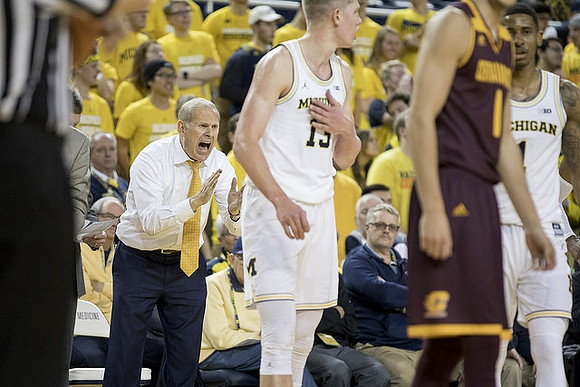 John Beilein, Moritz Wagner (13), and Charles Matthews (1)