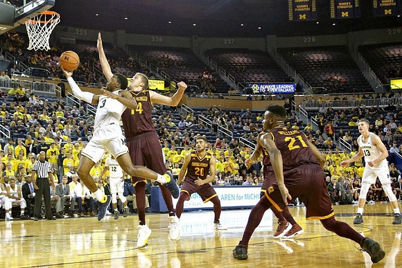 Zavier Simpson (3), Muhammad-Ali Abdur-Rahkman (12), and Moritz Wagner (13)