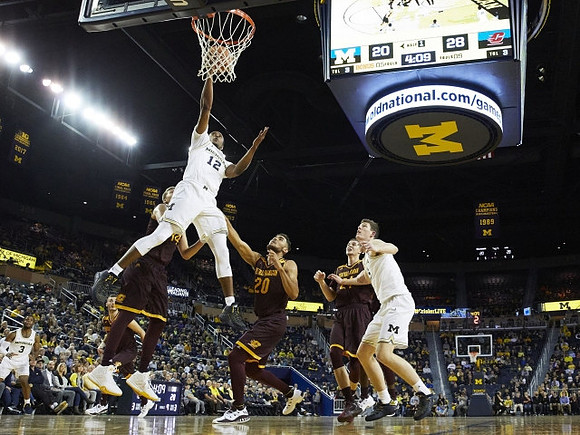 Zavier Simpson (3), Moritz Wagner (13), and Jon Teske (15)