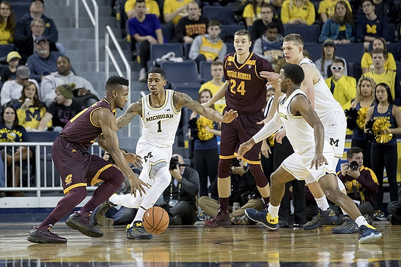 Charles Matthews (1), Zavier Simpson (3), and Moritz Wagner (13)