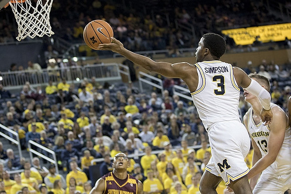 Zavier Simpson (3) and Moritz Wagner (13)