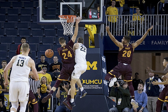 Moritz Wagner (13) and Duncan Robinson (22)