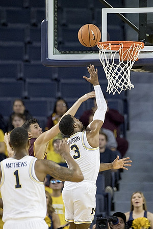 Charles Matthews (1) and Zavier Simpson (3)