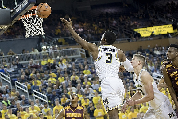 Zavier Simpson (3) and Moritz Wagner (13)