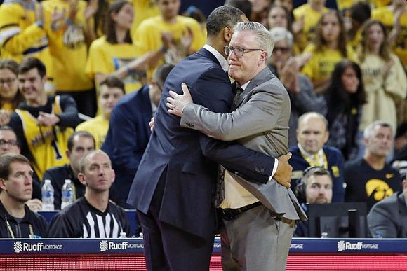 Juwan Howard and Iowa Head Coach Fran McCaffery
